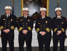 2013-14 Chiefs and Commissioner (L-R) Fire Commissioner Tim Hutchings, 1st Asst. Chief James Schermerhorn, Chief Craig Haigh, 2nd Asst. Chief Anthony DeMarco