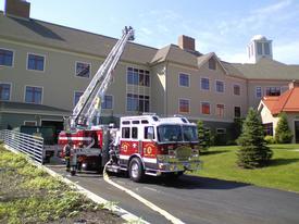 Crews from Tower Ladder 32 prepare for drill operations at the FASNY Fireman's Home in Hudson
